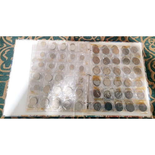 105 - A folder of British coinage and a tin of British pennies. UK shipping £14.