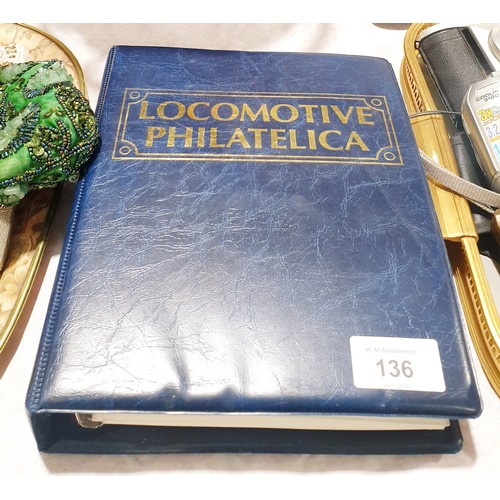 136 - A Locomotive Philatelica, a folder of train stamps. UK shipping £14.