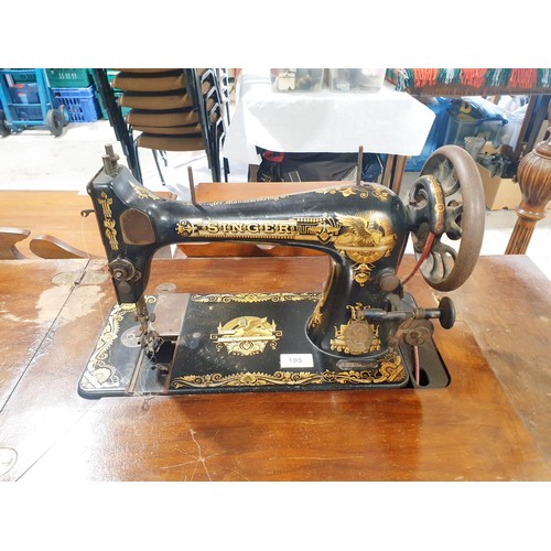 195 - A vintage Singer sewing machine and treadle table, height 75.5cm. No shipping. Arrange collection or... 