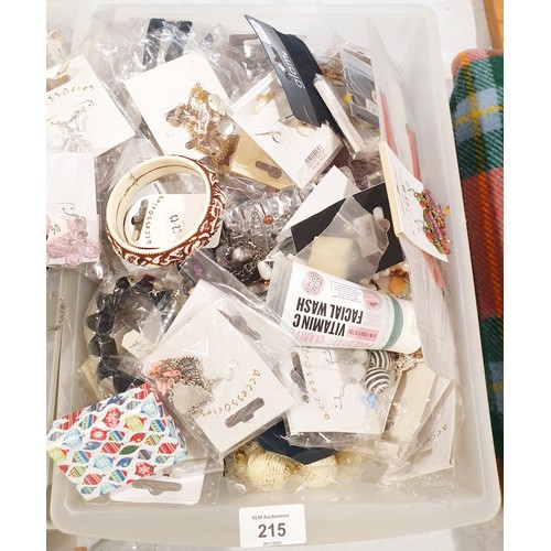 215 - A box of new in packet costume jewellery. UK shipping £14.