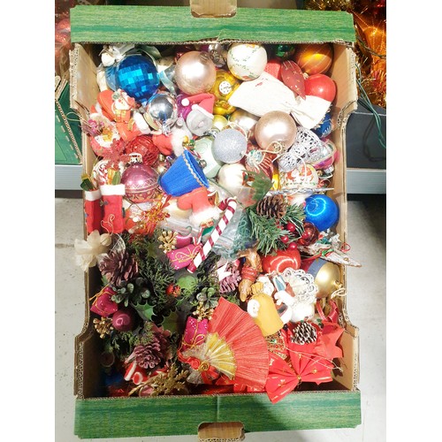 218 - Four boxes of Christmas decorations. No shipping. Arrange collection or your own packer and shipper,... 