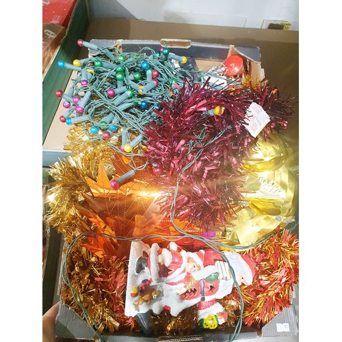 218 - Four boxes of Christmas decorations. No shipping. Arrange collection or your own packer and shipper,... 