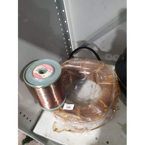 246 - A new in packet roll of copper welding wire together with a roll of copper thread. No shipping. Arra... 