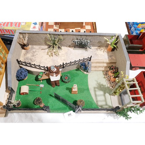 268 - A model garden diorama, length 56cm. No shipping. Arrange collection or your own packer and shipper,... 