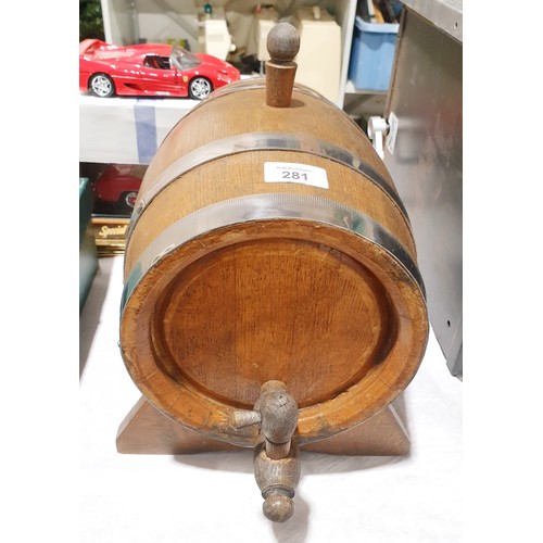 281 - A wooden and steel bound barrel on a stand, length including tap 37cm. No shipping. Arrange collecti... 