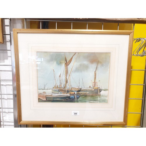 286 - T. A. Hutchinson: a watercolour drawing depicting boats at anchor, signed and dated 1988 lower right... 