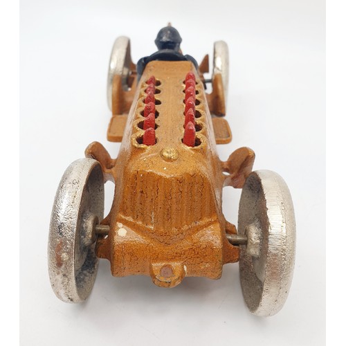 307 - A reproduction cast iron model of a racing car with articulation, length 28.5cm. UK shipping £14.