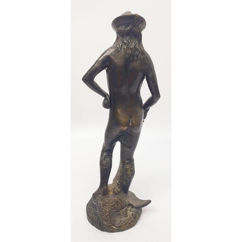 323 - A bronze figure of David after Donatello, height 24.5cm together with a cast metal figure of a balle... 