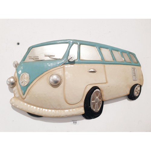 332 - Two tin plate VW  camper wall plaques, the longest 81.5cm together with a model of a VW camper van. ... 