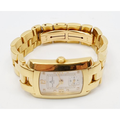 8 - A ladies boxed 18ct gold Baume & Mercier quartz wrist watch, on an 18ct gold bracelet, having a cham... 