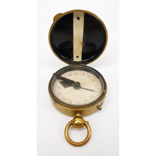 37 - A World War I brass marching compass by J. I. Steward, London, diameter 5cm together with leather be... 