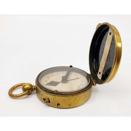 37 - A World War I brass marching compass by J. I. Steward, London, diameter 5cm together with leather be... 