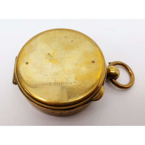 37 - A World War I brass marching compass by J. I. Steward, London, diameter 5cm together with leather be... 