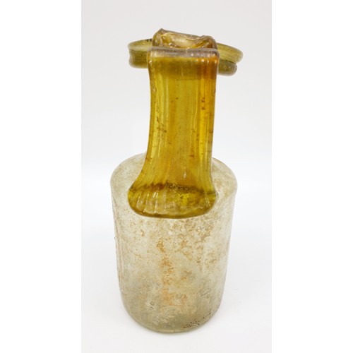 40 - Antiquities: a Roman green glass jug with label to base from the J. R. Preece Collection, height 18c... 