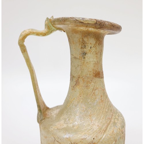 41 - Antiquities: A Roman iridescent glass jug, height 12cm. No shipping. Arrange collection or your own ... 