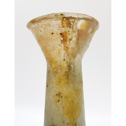 42 - Antiquities: a Roman iridescent glass unguentarium, height 18cm. No shipping. Arrange collection or ... 