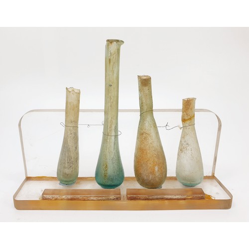 46 - Antiquities: five Roman glass unguentarium bottles, the tallest 12.5cm. No shipping. Arrange collect... 