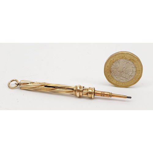 27 - A hallmarked 9ct gold propelling pencil, length extended 7cm, gross weight 4.2g. UK shipping £14.