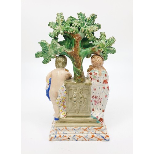 51 - A 19th century Staffordshire pearlware bocage figure of two children around a plinth, height 19.5cm.... 