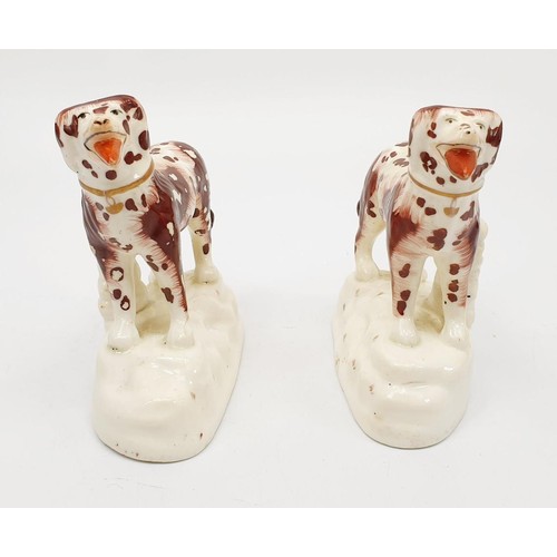 58 - A pair of 19th century Staffordshire pearlware tan marked hunting dogs, the tallest 11cm. No shippin... 