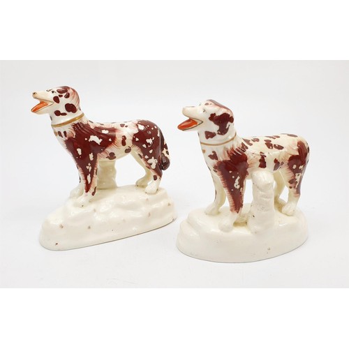 58 - A pair of 19th century Staffordshire pearlware tan marked hunting dogs, the tallest 11cm. No shippin... 