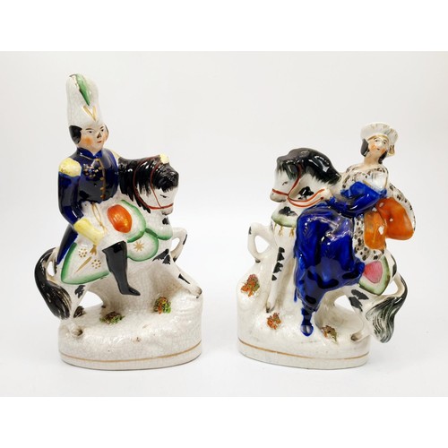 63 - A pair of 19th century Staffordshire pearlware figures of Queen Victoria and Prince Albert on horseb... 