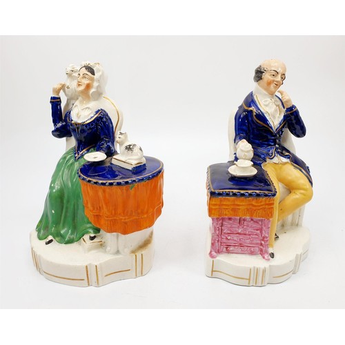 67 - A pair of 19th century Staffordshire pearlware figures of a seated lay and gentleman, height 19cm, b... 