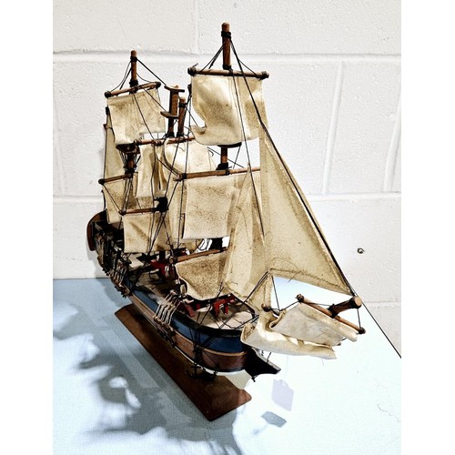 13 - A wooden model of HMS Endeavour, height 43.5cm. No shipping. Arrange collection or your own packer a... 