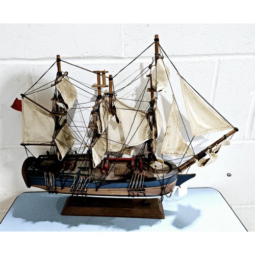 13 - A wooden model of HMS Endeavour, height 43.5cm. No shipping. Arrange collection or your own packer a... 