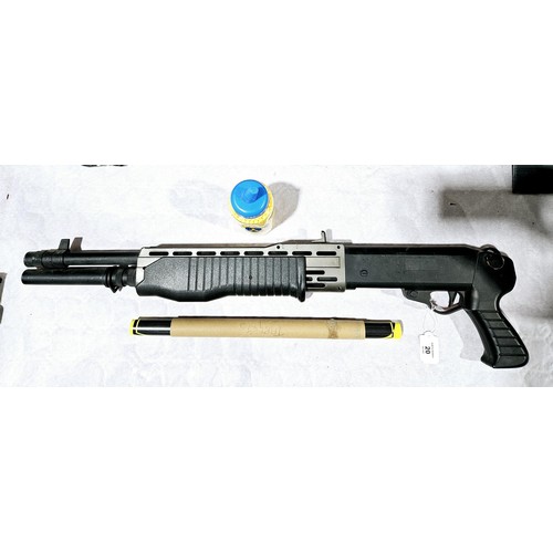 20 - A spring powered plastic BB gun, length 77cm. No shipping. Arrange collection or your own packer and... 