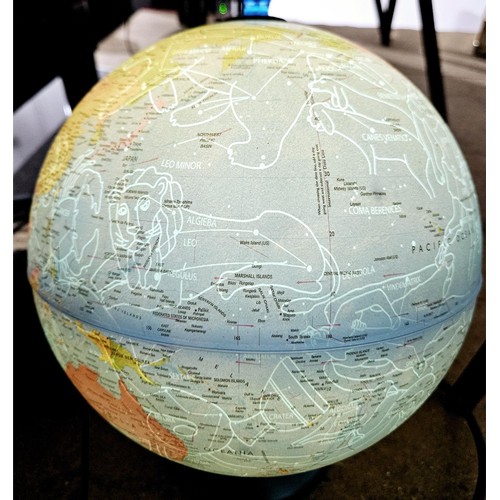 25 - An illuminated globe, once illuminated showing the constellations, height 37cm. No shipping. Arrange... 