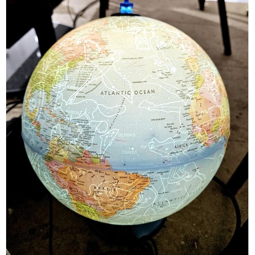 25 - An illuminated globe, once illuminated showing the constellations, height 37cm. No shipping. Arrange... 