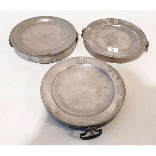 43 - Three antique pewter plate warmers, two having London stamps, diameter 24cm. UK shipping £14.