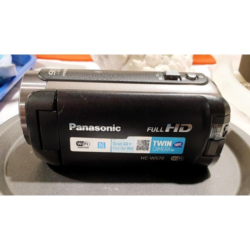 58 - A Panasonic HC-W570 video camera. UK shipping £14. Electricals are sold as scrap.