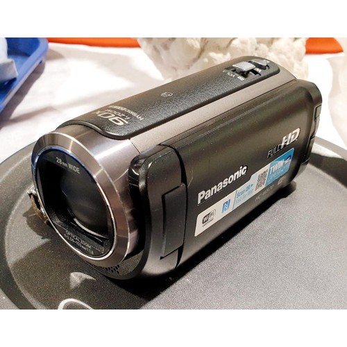 58 - A Panasonic HC-W570 video camera. UK shipping £14. Electricals are sold as scrap.