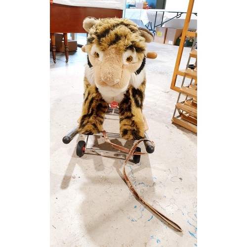 112 - A Trupa ride-on and rocking tiger, length 76cm, height 58cm. No shipping. Arrange collection or your... 