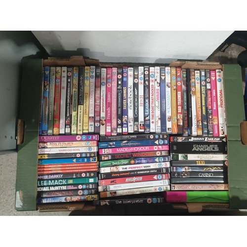 137 - Three boxes of DVDs. No shipping. Arrange collection or your own packer and shipper, please. Electri... 