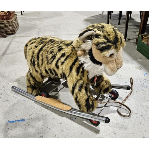 112 - A Trupa ride-on and rocking tiger, length 76cm, height 58cm. No shipping. Arrange collection or your... 