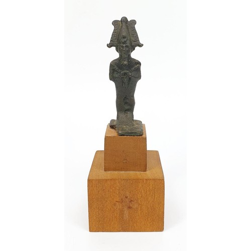 11 - An ancient Egyptian cast bronze figure of Osiris on a later wooden plinth, height including plinth 1... 