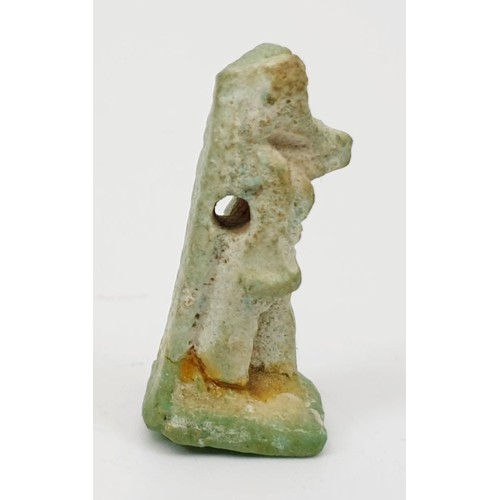 14 - An ancient Egyptian faience amulet in the form of the god Anubis, height 27mm. UK shipping £14.