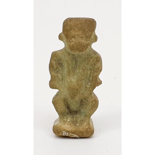 16 - A ancient Egyptian faience amulet in the form of the god  Bes, height 22mm. UK shipping £14.