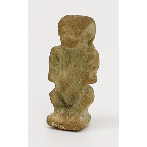 16 - A ancient Egyptian faience amulet in the form of the god  Bes, height 22mm. UK shipping £14.