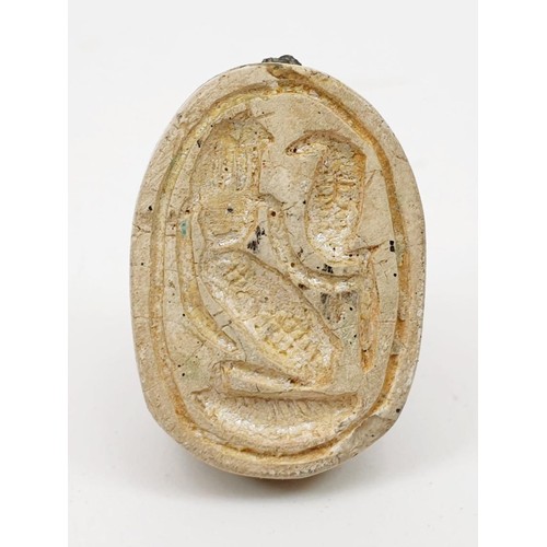 17 - An ancient Egyptian scarab seal with a wax impression of the seal, length 22mm. UK shipping £14.