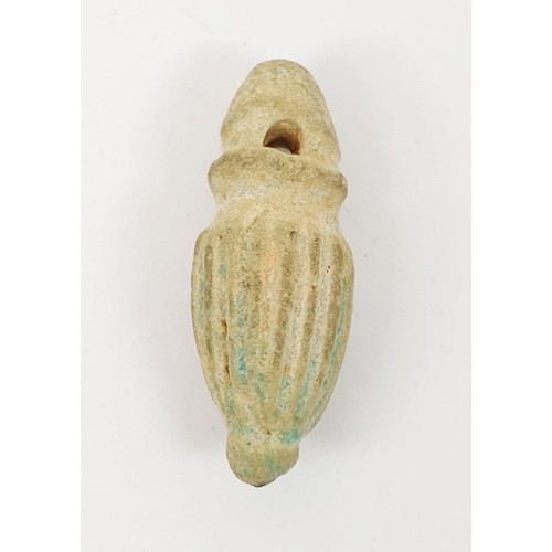 21 - An ancient Egyptian faience bead with hieroglyphs, length 13mm, a scarab seal, width 11mm and a faie... 