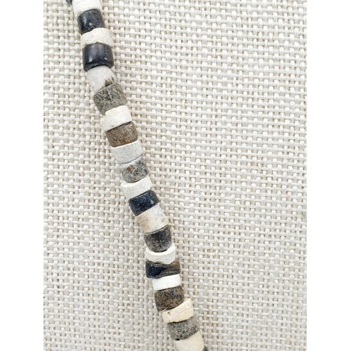 22 - An ancient Egyptian hard stone bead necklace. UK shipping £14.