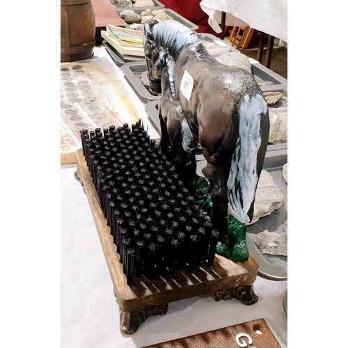 67 - A cast iron and wood horse motive boot brush/door stop, width 28cm. UK shipping £14.