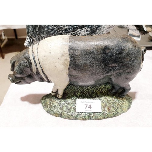 74 - A cast iron badger door stop, width 27cm together with a cast iron pig door stop, width 21cm. UK shi... 