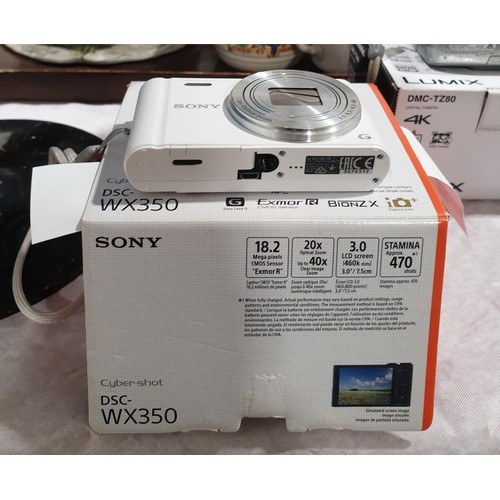 96 - A Sony Cyber Shot DCS-WX350 digital camera. UK shipping £14. Electricals are sold as scrap.