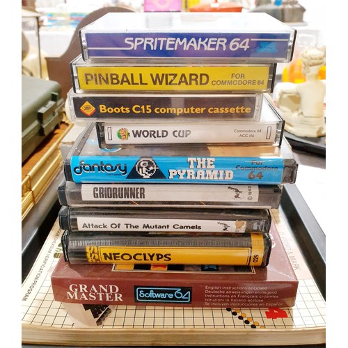 147 - A boxed Commodore 64 cassette deck together with Commodore 64 games and a book. Electricals are sold... 