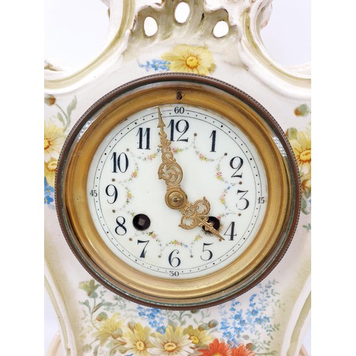 194 - A 19th century Royal Bonn ceramic mantel clock in the Rococo style, hand painted with flowers and ha... 